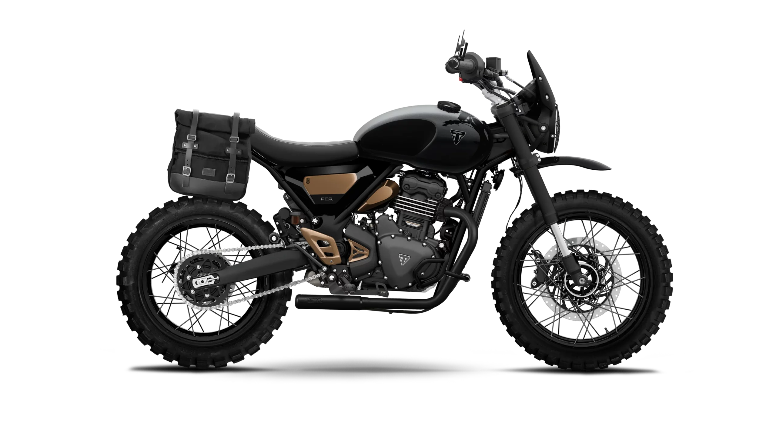 Triumph Speed 400 XC Scrambler Escape noire avec accents bronze signée FCR Original, configuration off-road comprenant pneus tout-terrain, silencieux relevé, pare-mains et bagagerie latérale.