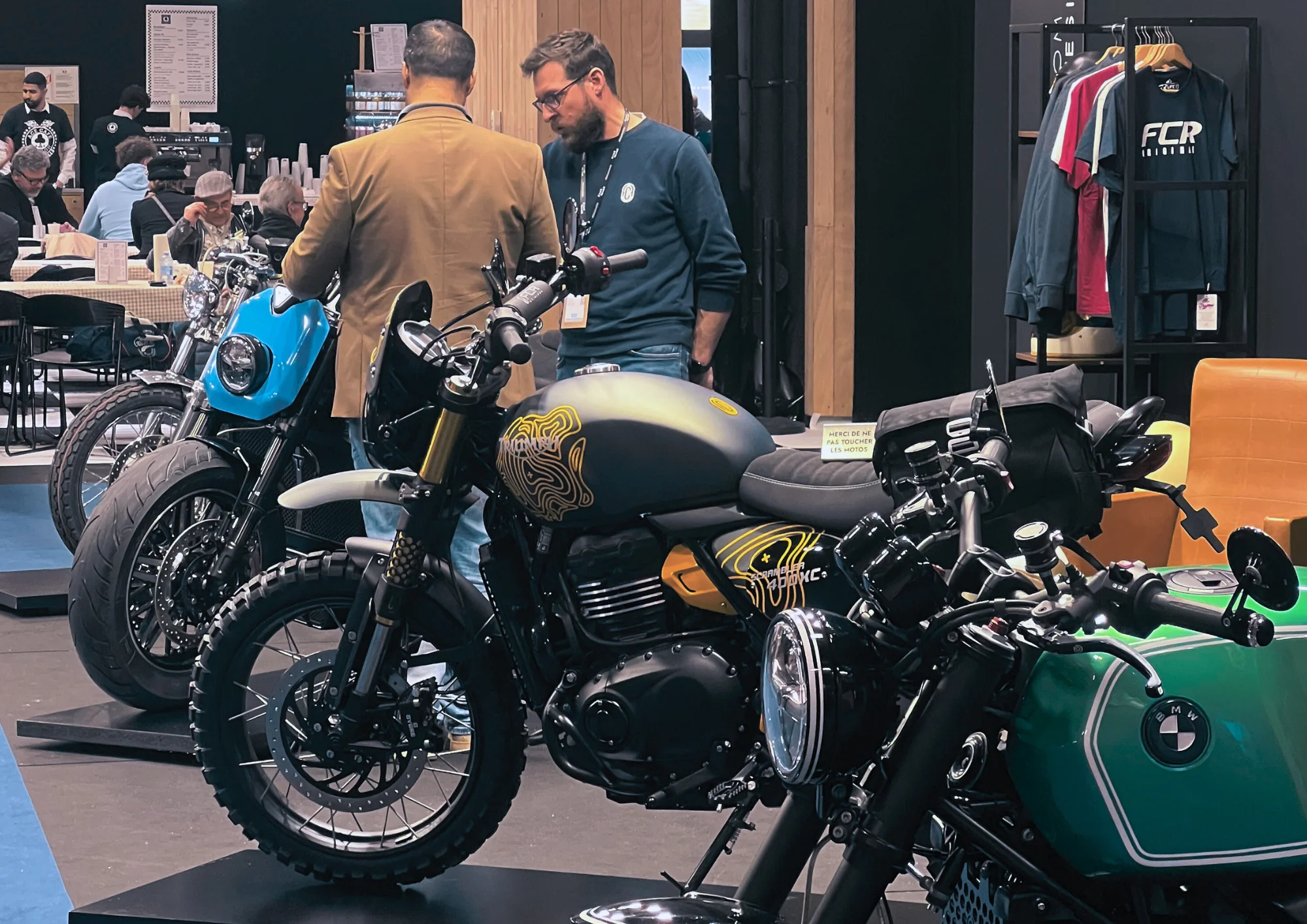 FCR Original stand at Rétromobile 2026, with preparation bikes on display and enthusiastic visitors discovering the workshop's creations.